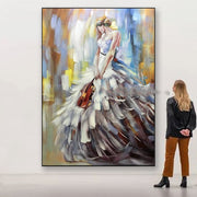 Elegant woman in a textured dress standing in front of a large canvas painting in a modern gallery setting.